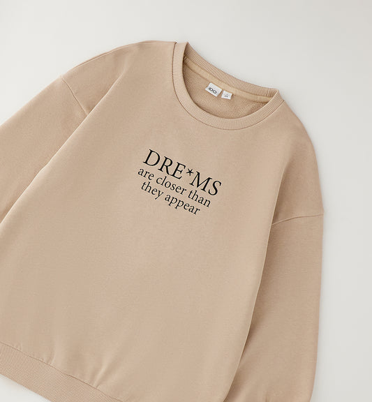 iDO Mädchen Sweatshirt Beige mit Dreams Statement-Print – Vorderansicht